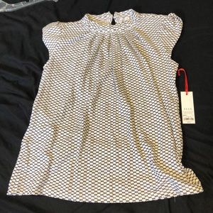 Super cute white and black blouse!